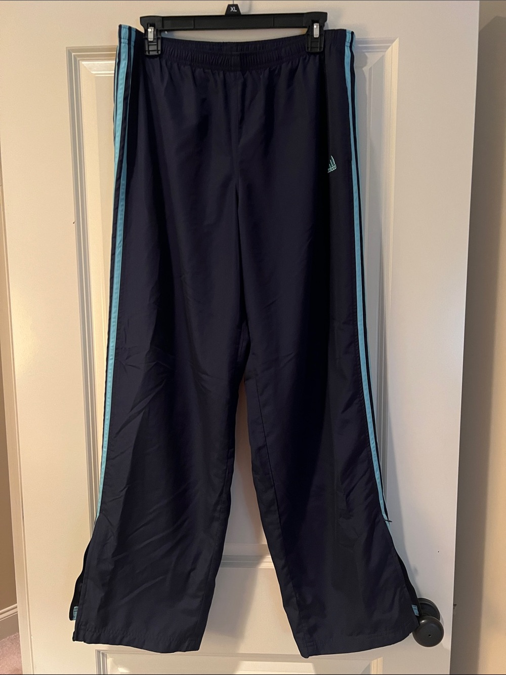 adidas navy track pants with 3 turquoise side stripes